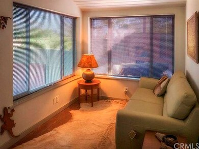 Sitting room/ office with view windows.