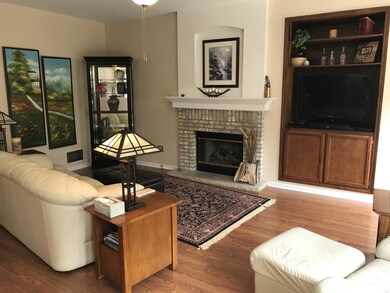 Large and bright family room has a built in entert