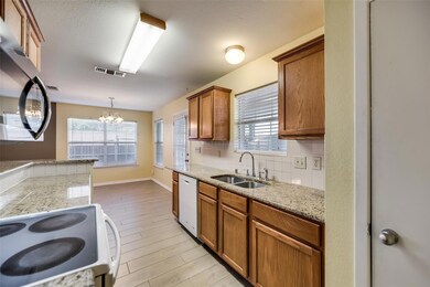 Kitchen with light hardwood / wood-style flooring,