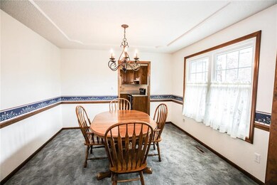 Formal dining room with lots of natural light.