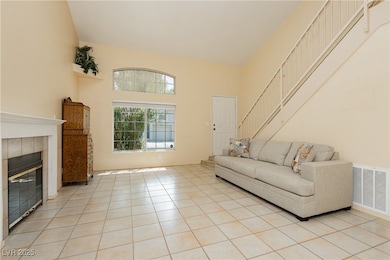 Living area featuring light tile patterned floorin