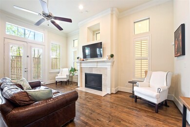 Large living room with gas fire place and wood flo