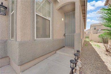 Doorway to property with stucco siding