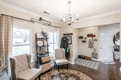 The front area of the home features a room (currently used as a piano room and den) that can be used as a formal dining room or flex space depending on your preferences. 