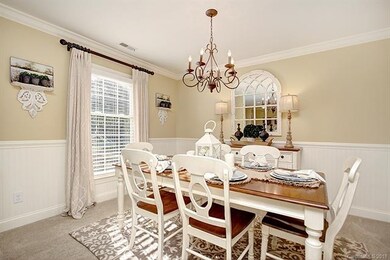 Dining room. Beautiful, wood crown molding, wainsc