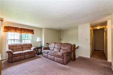 Large living/family room with loads of natural lig