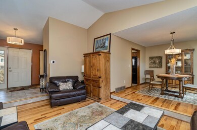 Open floor plan with vaulted ceiling