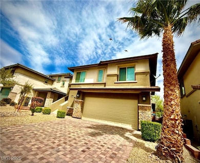 View of front of house featuring stone siding, an