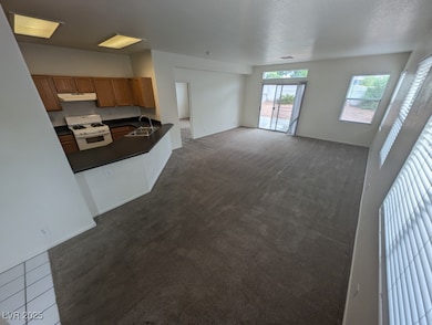 Unfurnished living room with a sink, visible vents