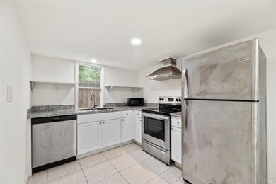 The kitchen is outfitted with stainless steel appl
