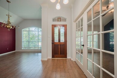 Step into elegance through a rich wooden door with