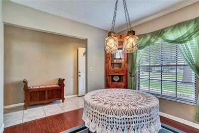 Foyer entrance opens to the formal dining room tha