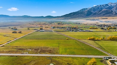 Aerial view of sparsely populated area with a mountainous background