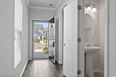 Doorway to outside featuring ornamental molding, s