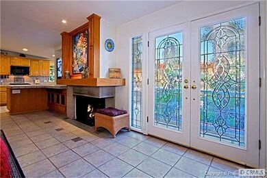 EDGED GLASS DOORS AND OPEN CONCEPT FIREPLACE