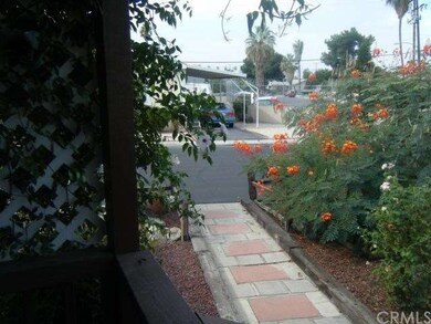 Beautiful flowers around walkway to front entrance