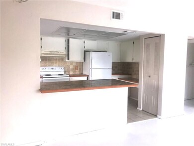 Open kitchen with breakfast bar and built-in desk