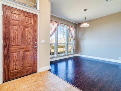 Foyer entrance featuring wood finished floors, vi