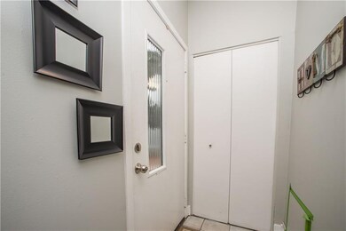 The front door opens into the bright foyer, which 