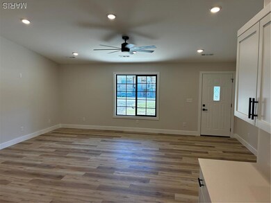 Entryway with light wood-type flooring, recessed lighting, and ceiling fan