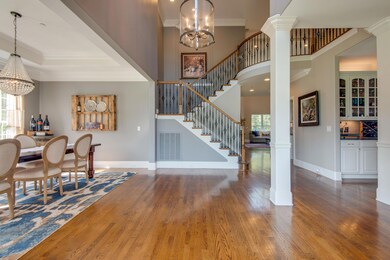 The grand two-story Entry shows the high quality of this home from the moment you walk inside.