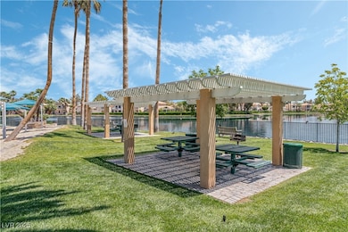 View of property's community featuring a pergola a