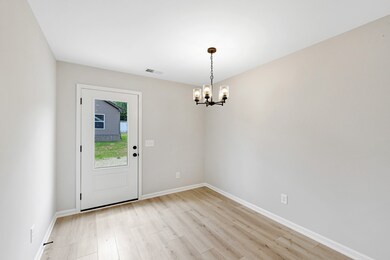 Large dining space with door to deck