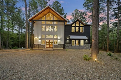 Back house at dusk with french doors