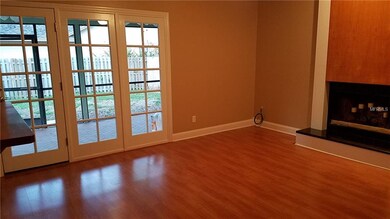 French doors in family room lead to large screened