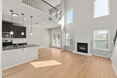 Sun drenched living room with tall ceilings