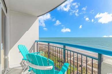Balcony featuring a beach view and a water view