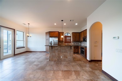 Kitchen with stainless steel appliances, arched w