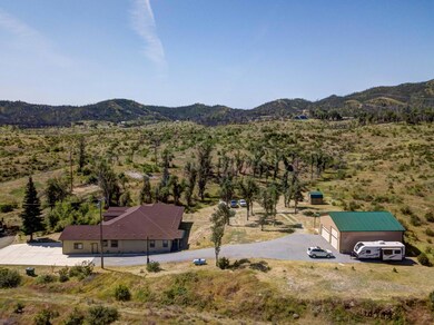 Drone shot side of house and shop lookin
