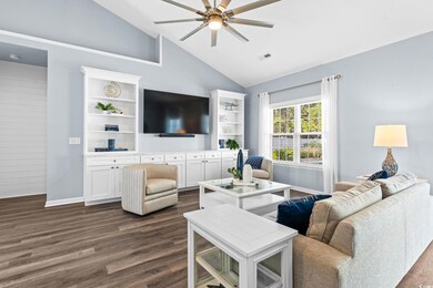 Living room with dark hardwood / wood-style floors