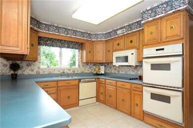 The functional kitchen offers ceramic tile floors 