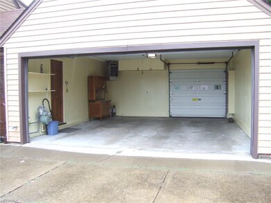 Two Car Garage With Access To Backyard.