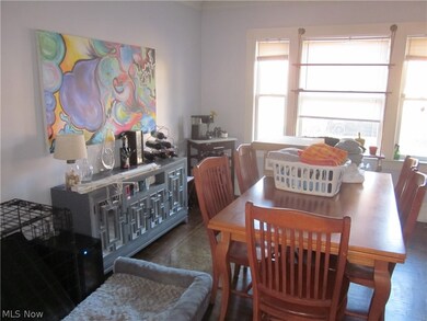 Dining room with a wealth of natural light and dark wood-type flooring