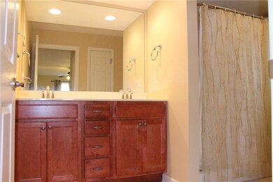 Master bath has high sinks and large walk-in showe