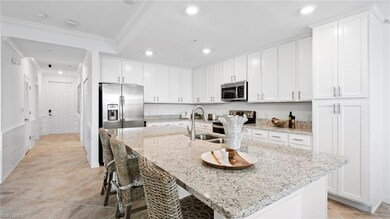 Kitchen with light stone counters, appliances with