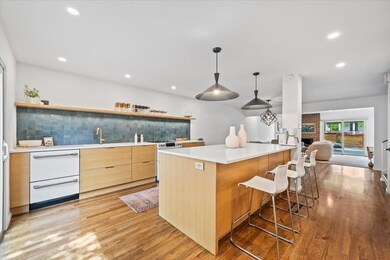 White Oak and White Quartz Euro Kitchen