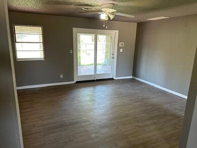 Unfurnished room with dark hardwood / wood-style f