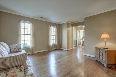 Formal living room features hardwood flooring
