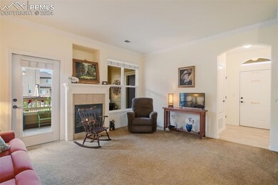 Living room with patio access and gas fireplace
