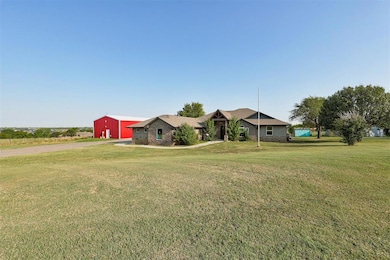 Ranch-style house with a front yard