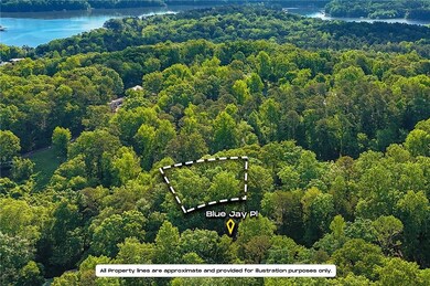 Bird's eye view featuring a wooded view and a wate