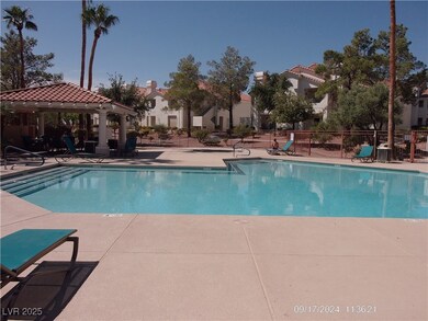 Community pool featuring a patio and a gazebo