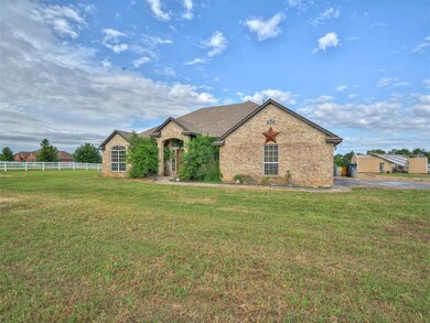 French country style house with brick siding and a shingled roof