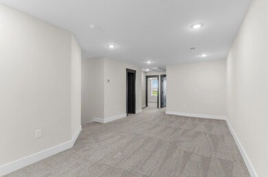 Spare room featuring light colored carpet