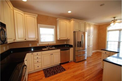 Kitchen has over sized cabinets, lots of storage, huge pantry, eat at bar and huge window.