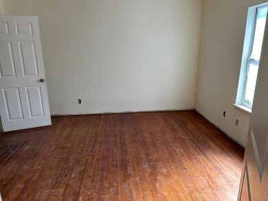 Empty room with wood-type flooring